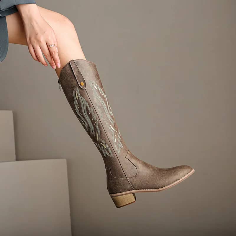 Chunky-Heel Western Boots in Cognac, worn by a model