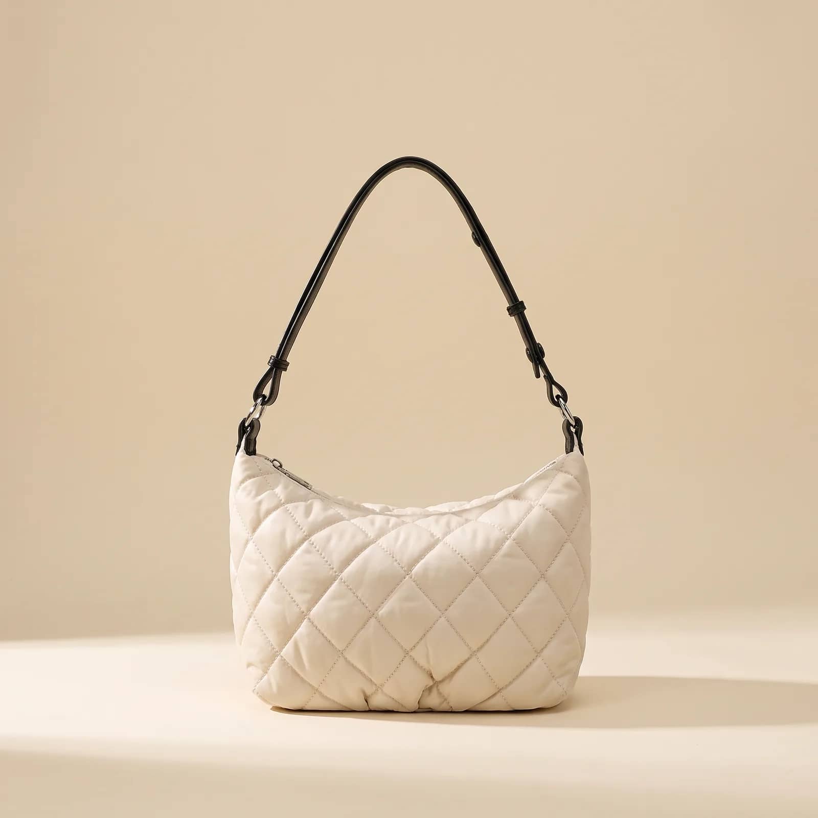 Quilted Nylon Crossbody in Mocha on a cream studio background
