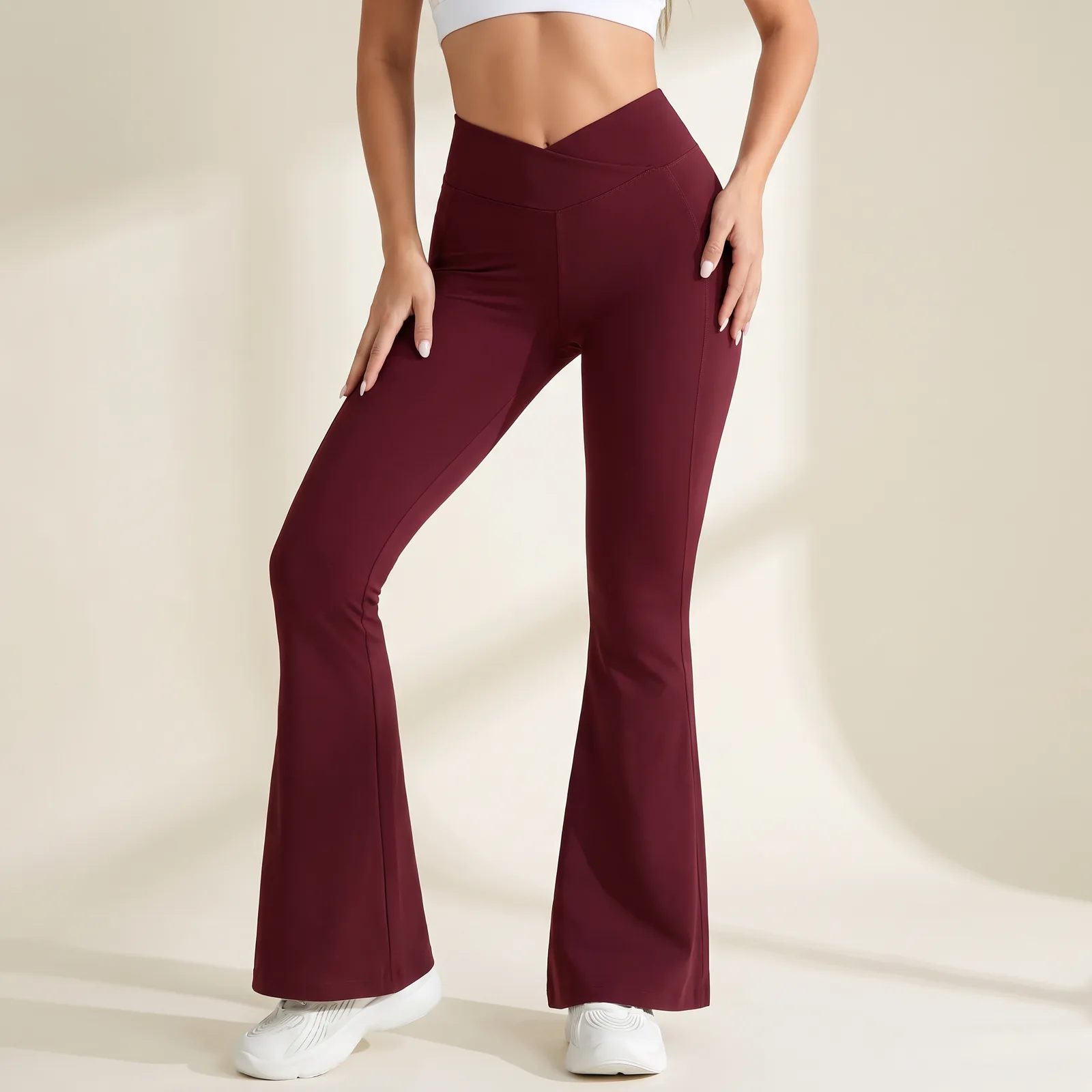Torso and legs from the waist down wearing the crossover flare pants
