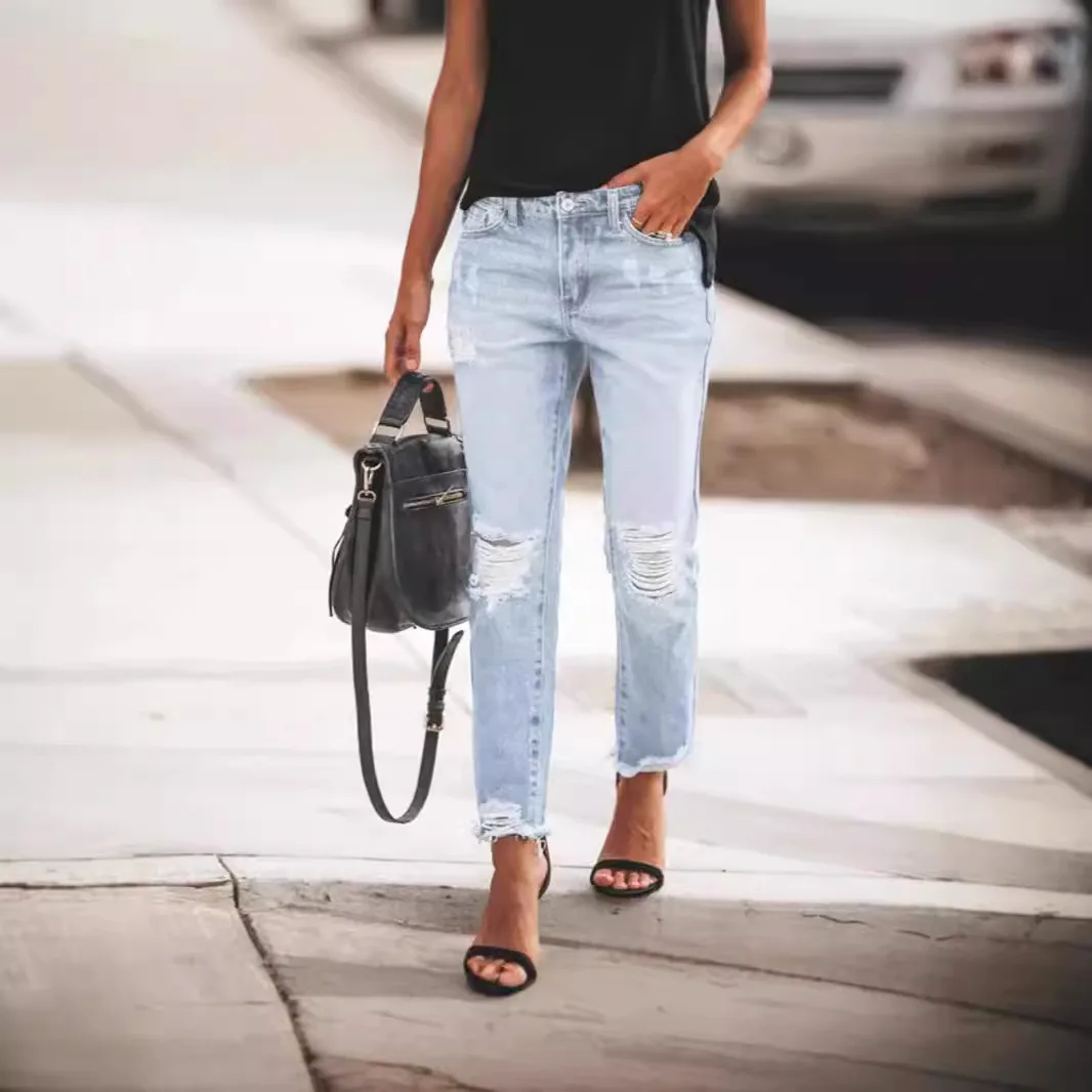 Distressed Straight-Leg Jeans in Light Wash, worn by a model