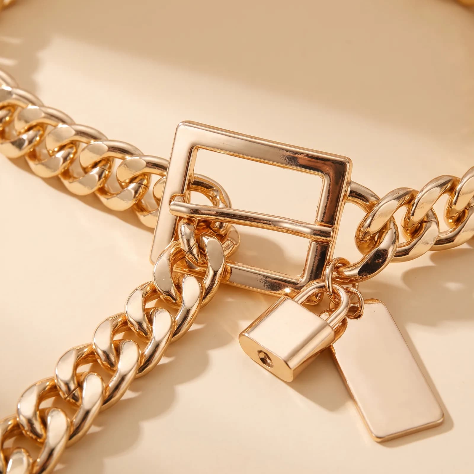 Close-up of the square buckle and the hanging charm