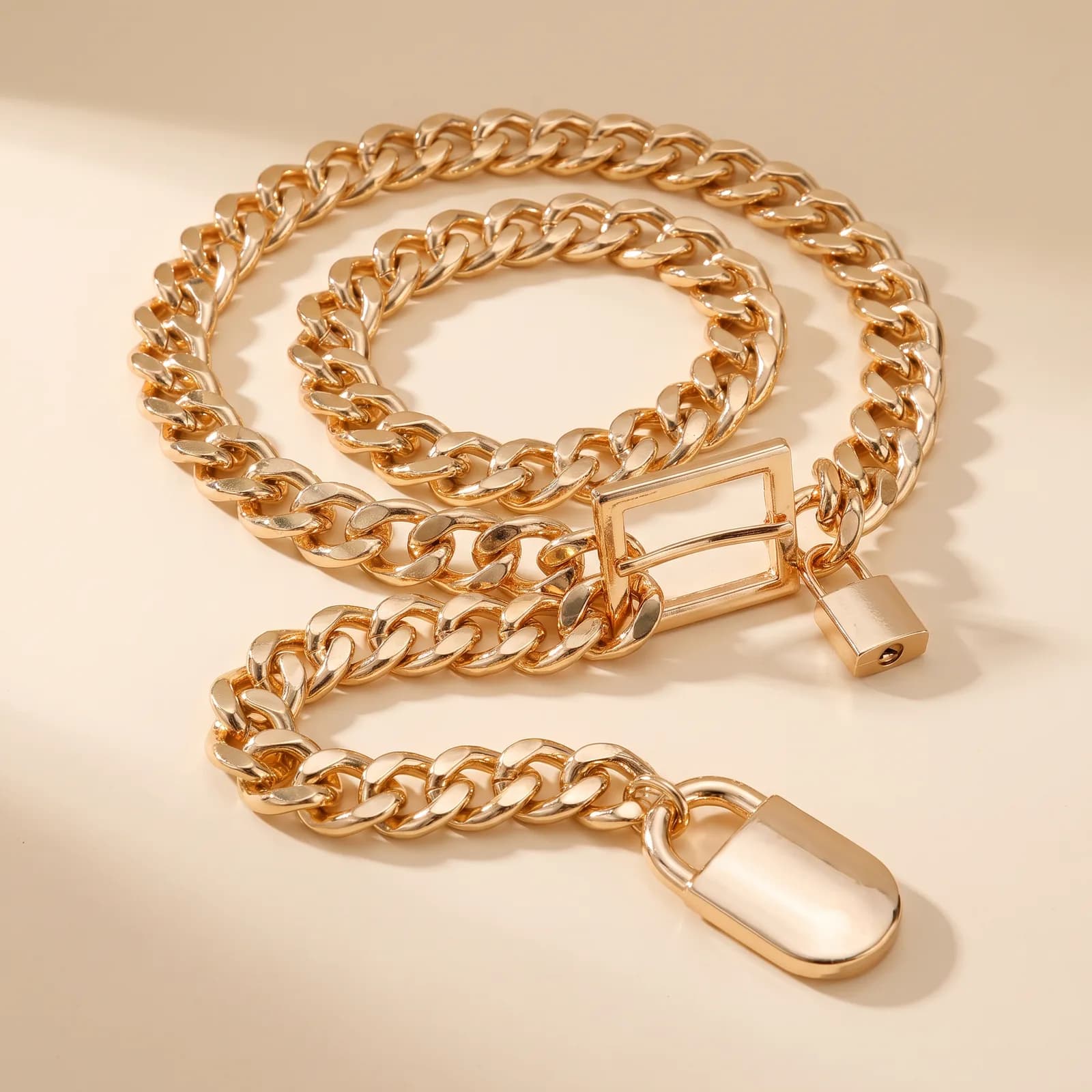 Western Chain Belt in Gold on a cream studio background