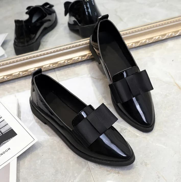 Patent Bow Pointed Flats in Black, flat lay
