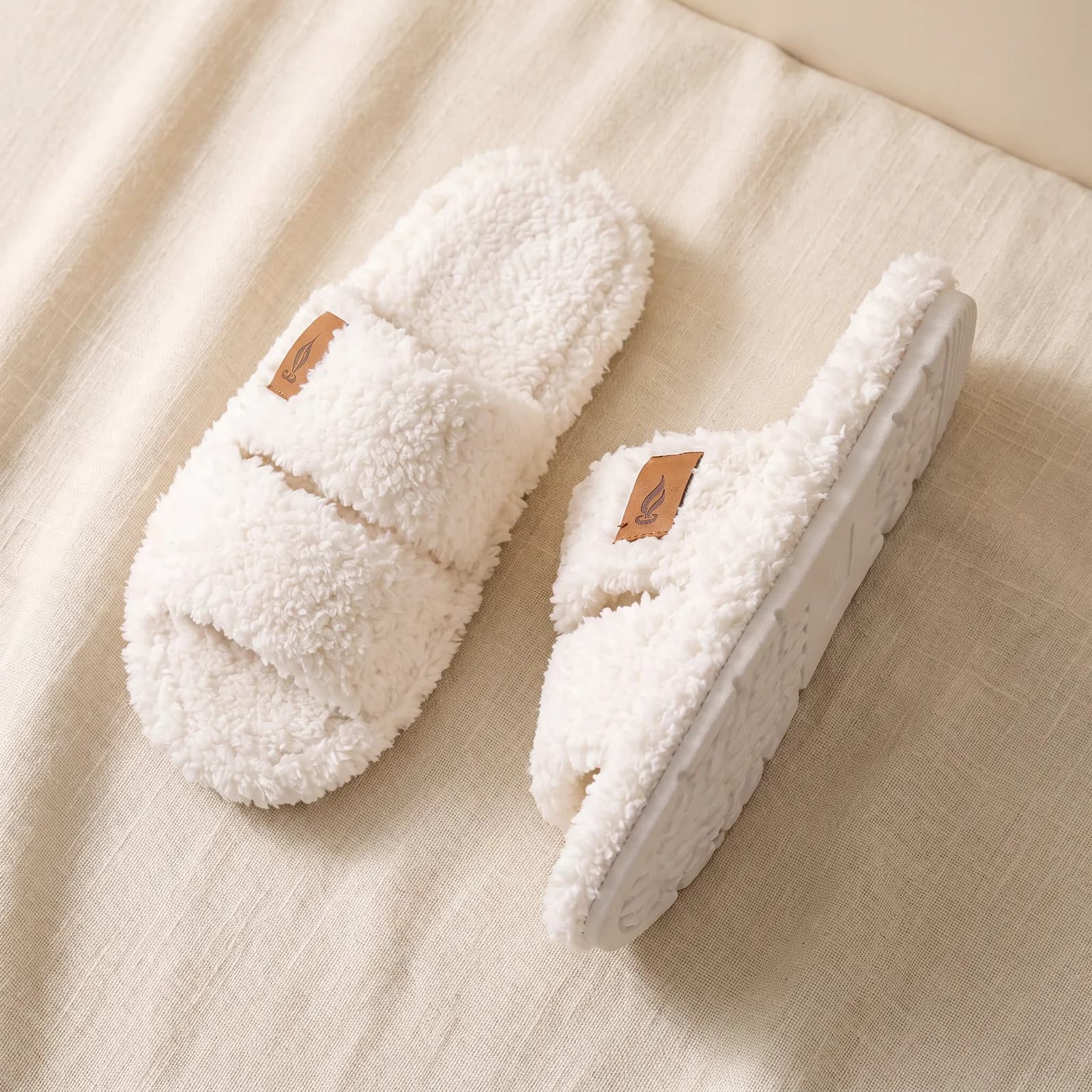 Both slides laid flat top-down on warm cream linen