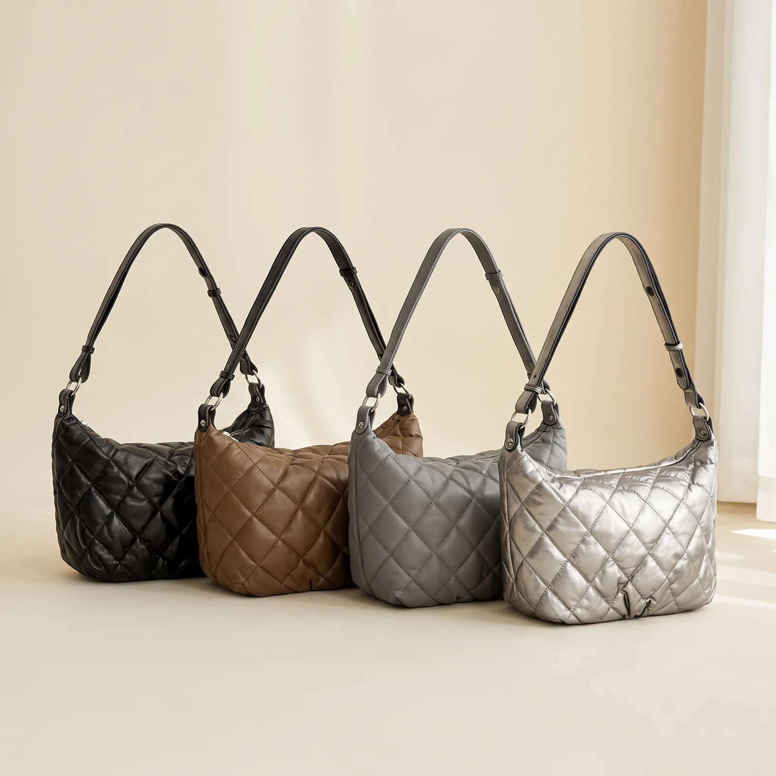 Black, Mocha, Grey, and Silver crossbody bags lined up side by side
