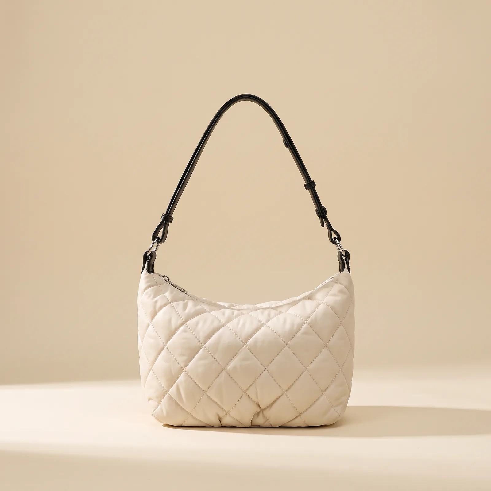 Quilted Nylon Crossbody in Mocha on a cream studio background