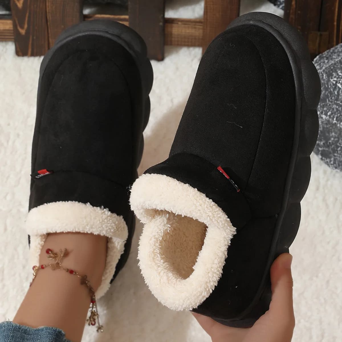 Suede Fleece-Lined House Shoes in Black, worn by a model