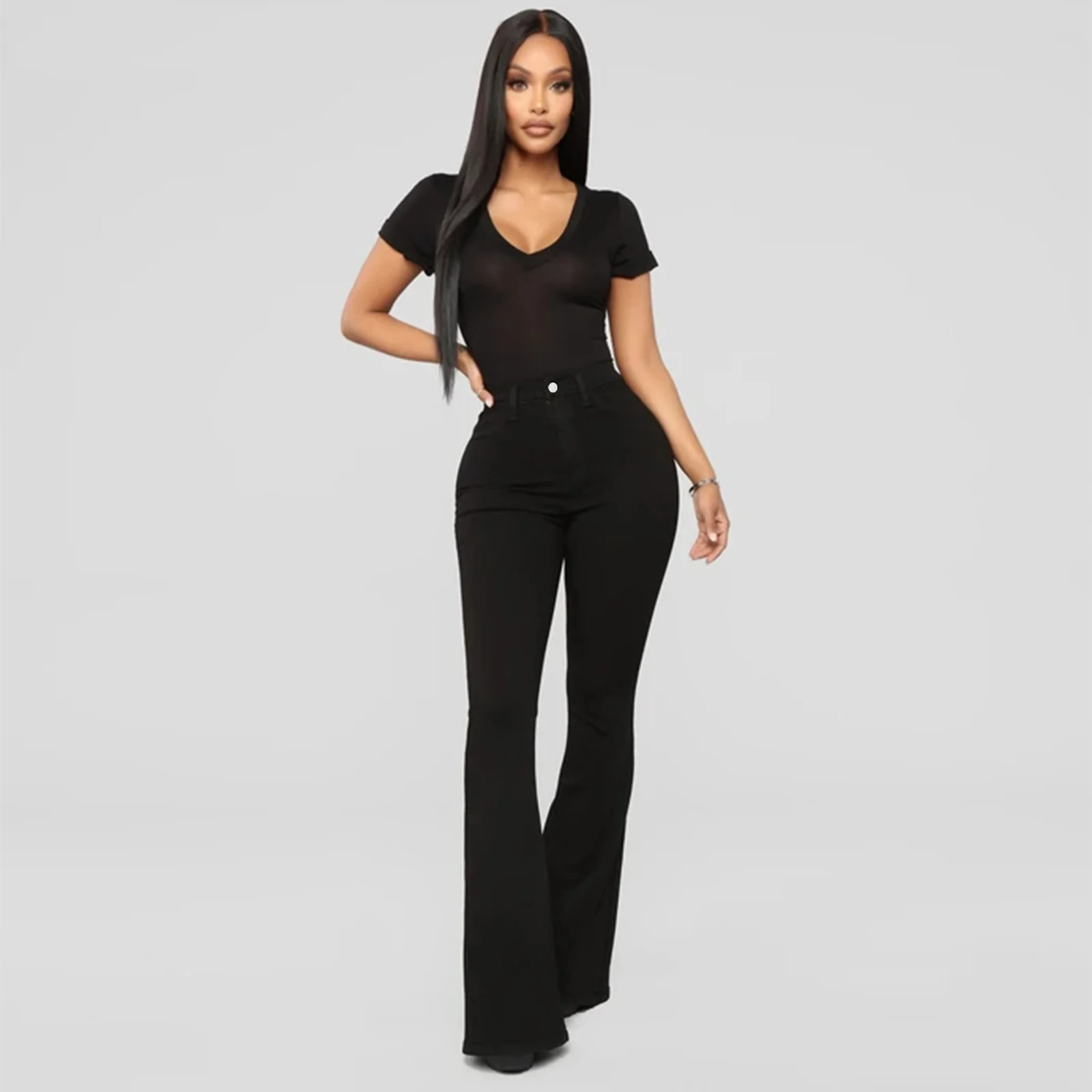 The Black bell-bottom flare worn full length, standing