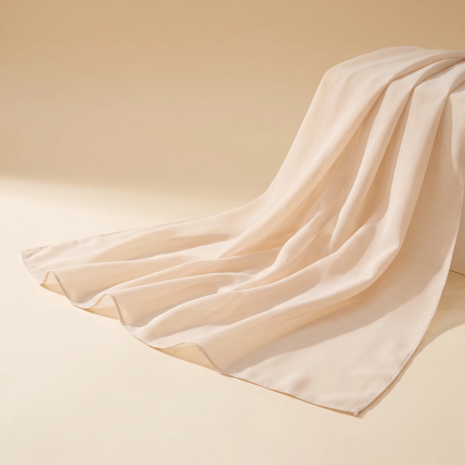 Pearl Chiffon Evening Shawl in Champagne on a cream studio background