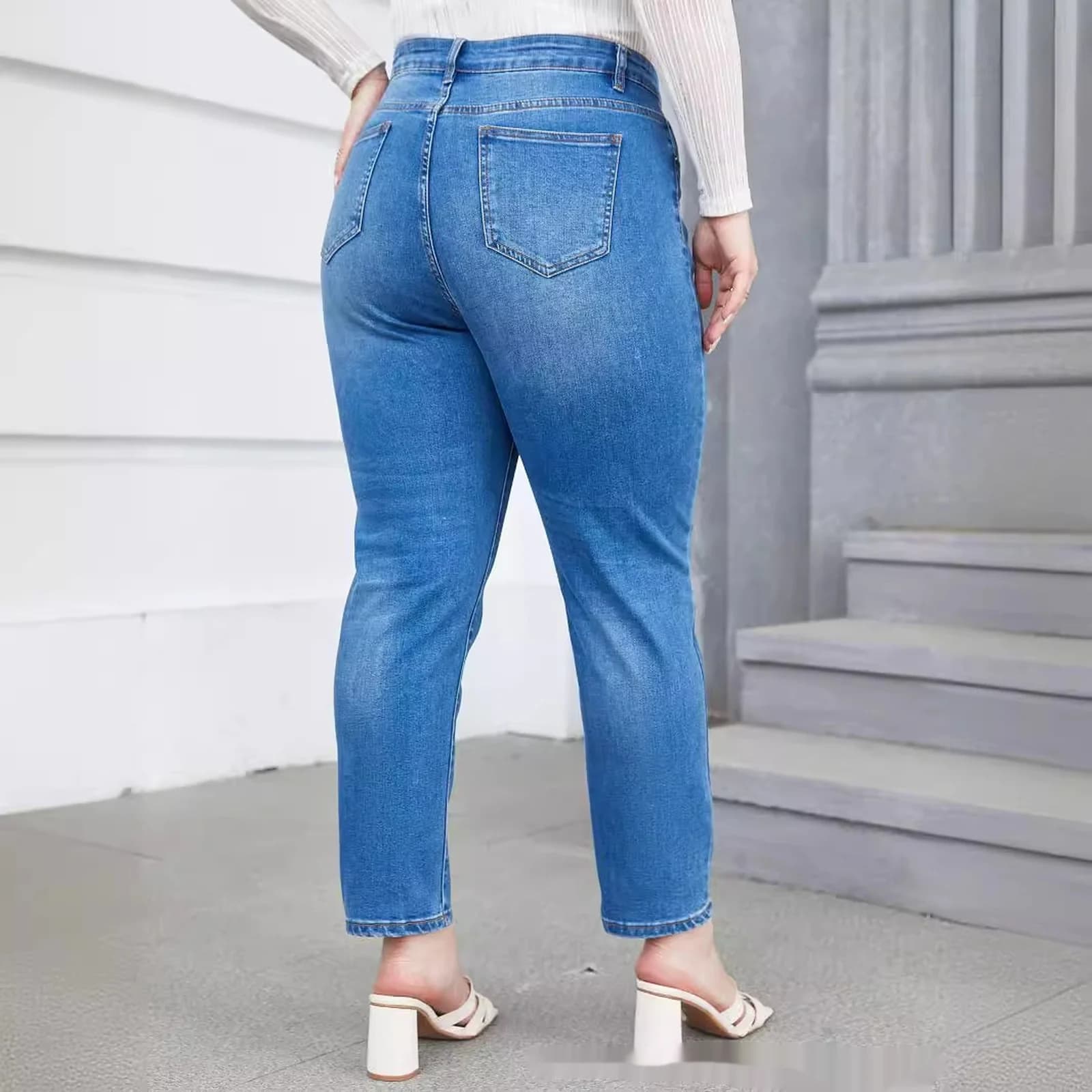Back view of the curvy tapered mom jeans showing the high rise and back pockets
