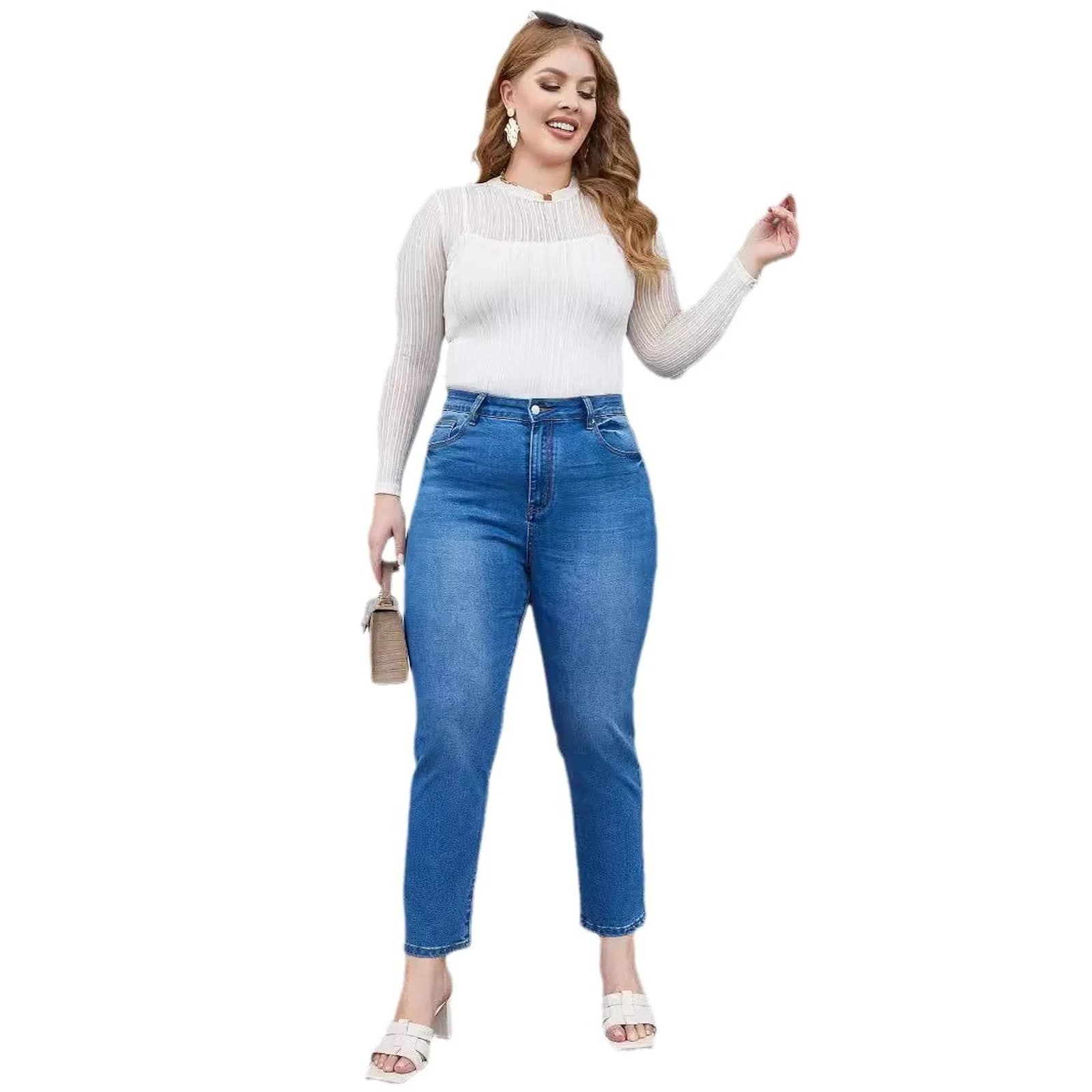 The curvy tapered mom jeans worn full length on stone steps