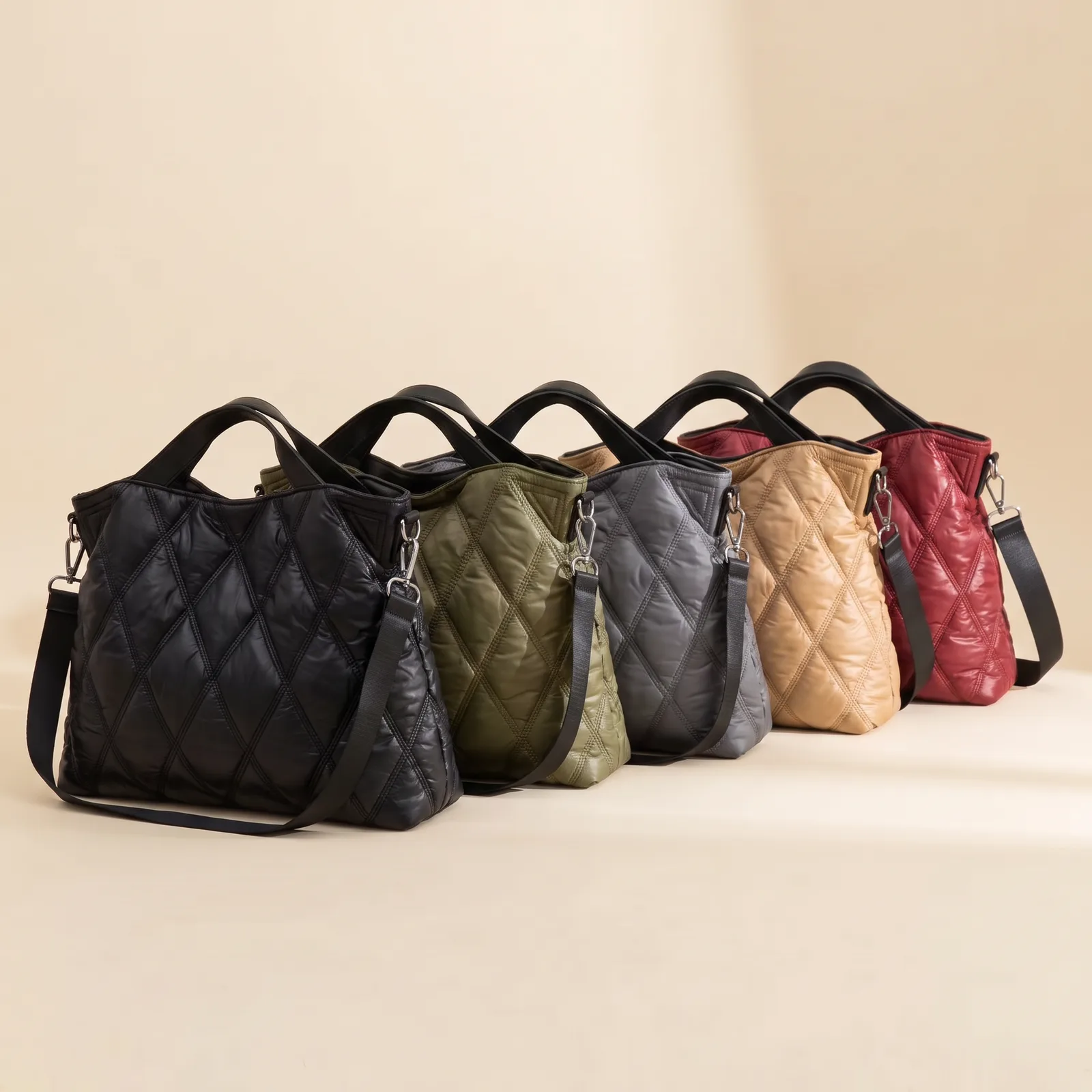 Black, Olive, Grey, Oat, and Cherry totes lined up side by side