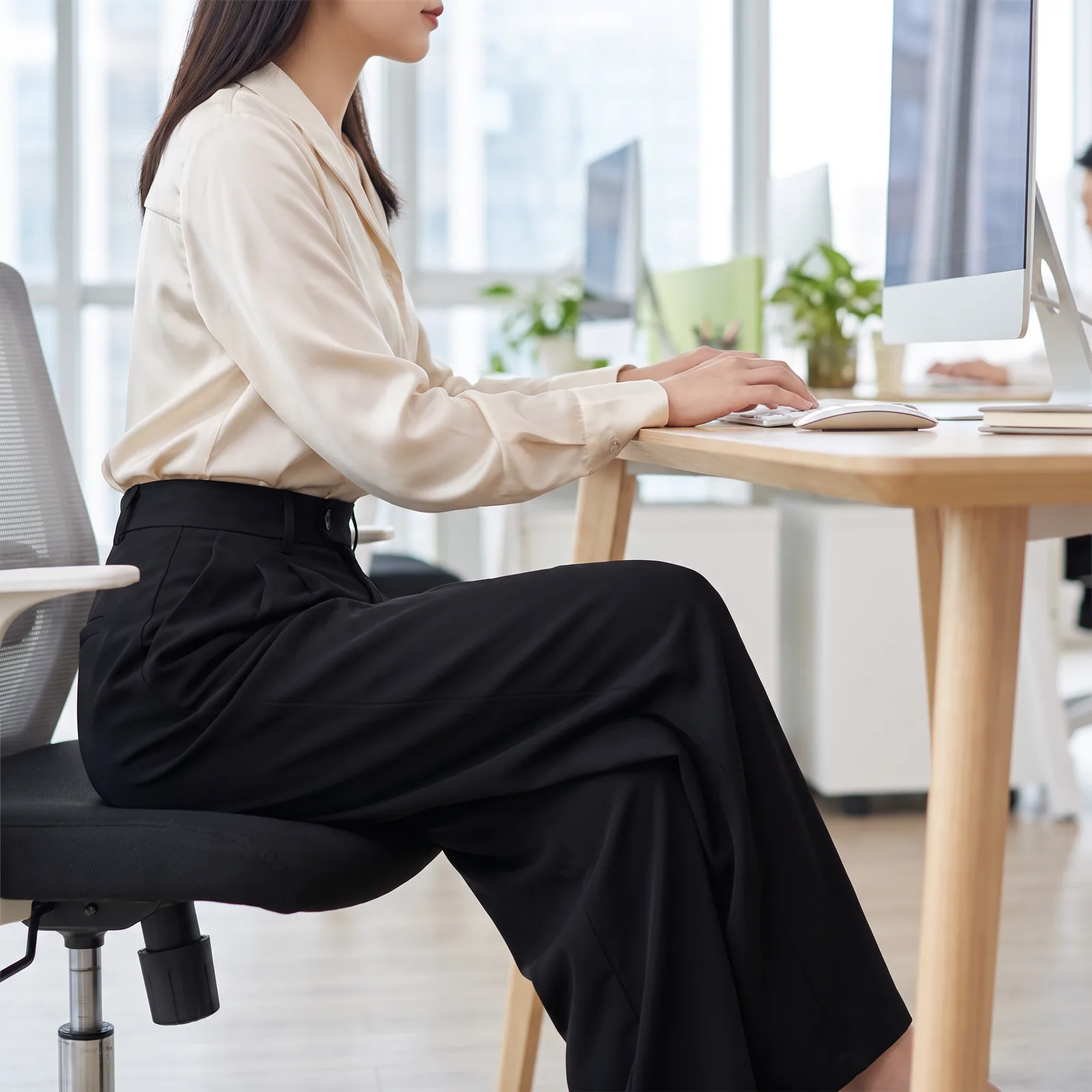 Trousers worn in an office setting near a desk, no faces