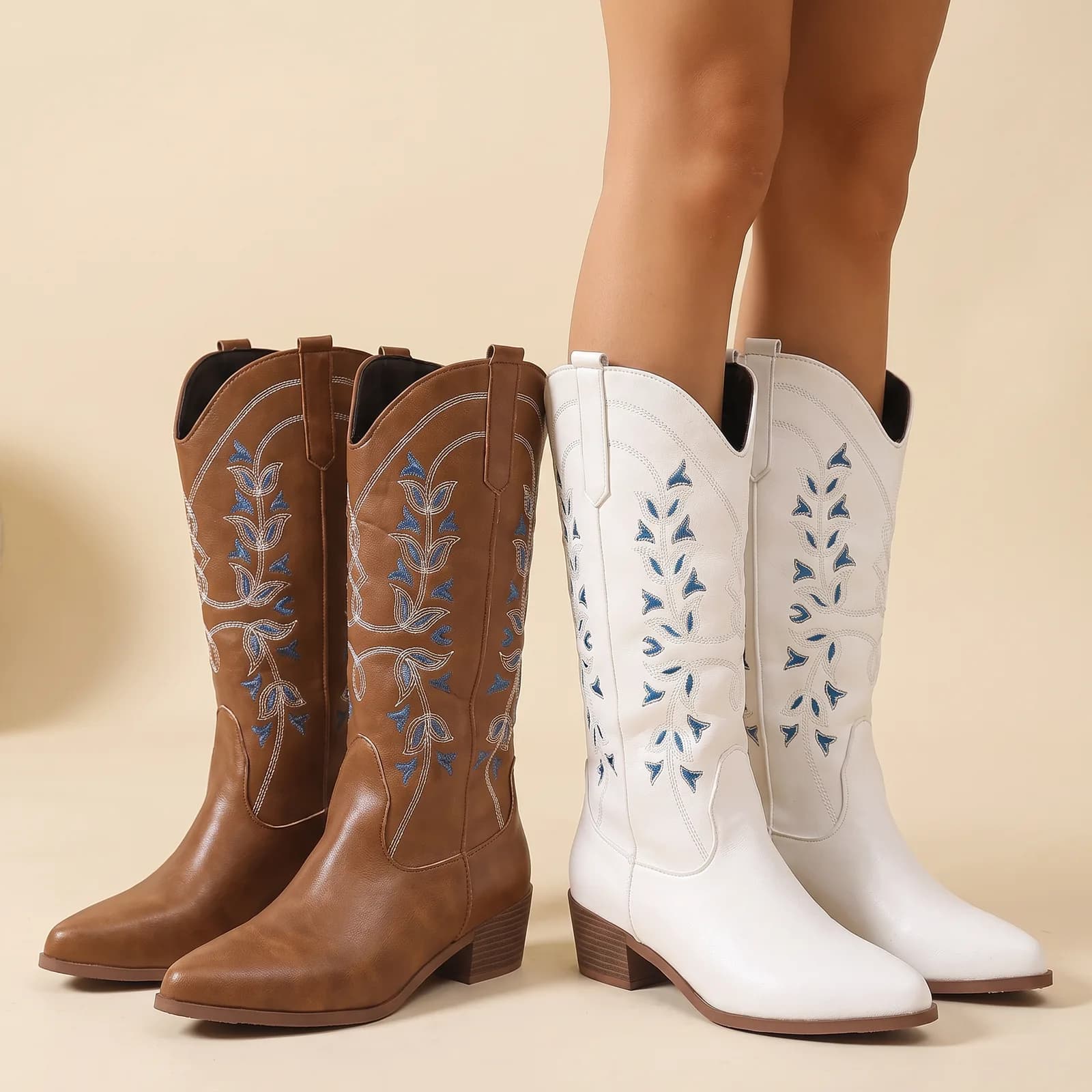 Saddle Brown and Ivory boots standing side by side