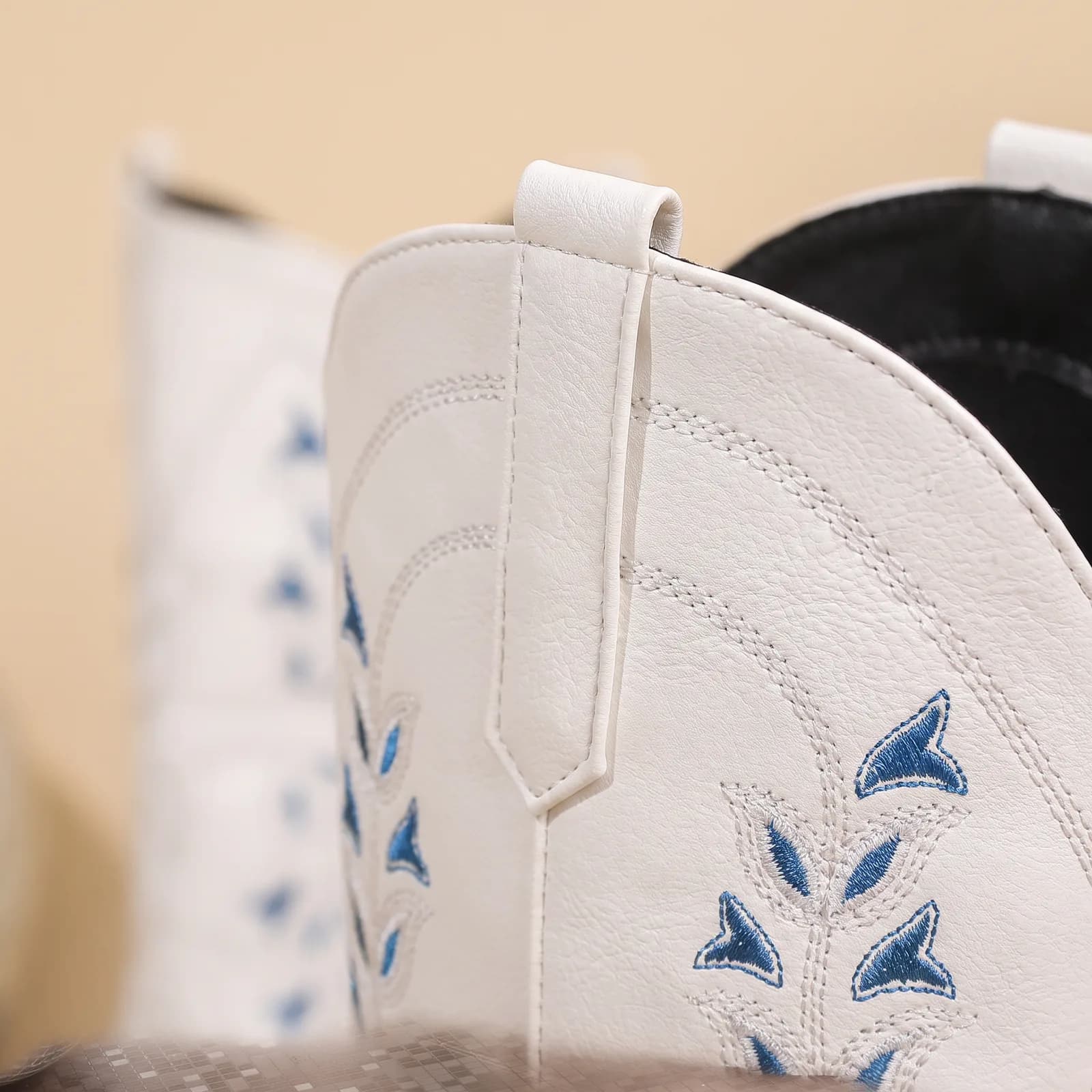 Close-up of the floral embroidery on the boot shaft