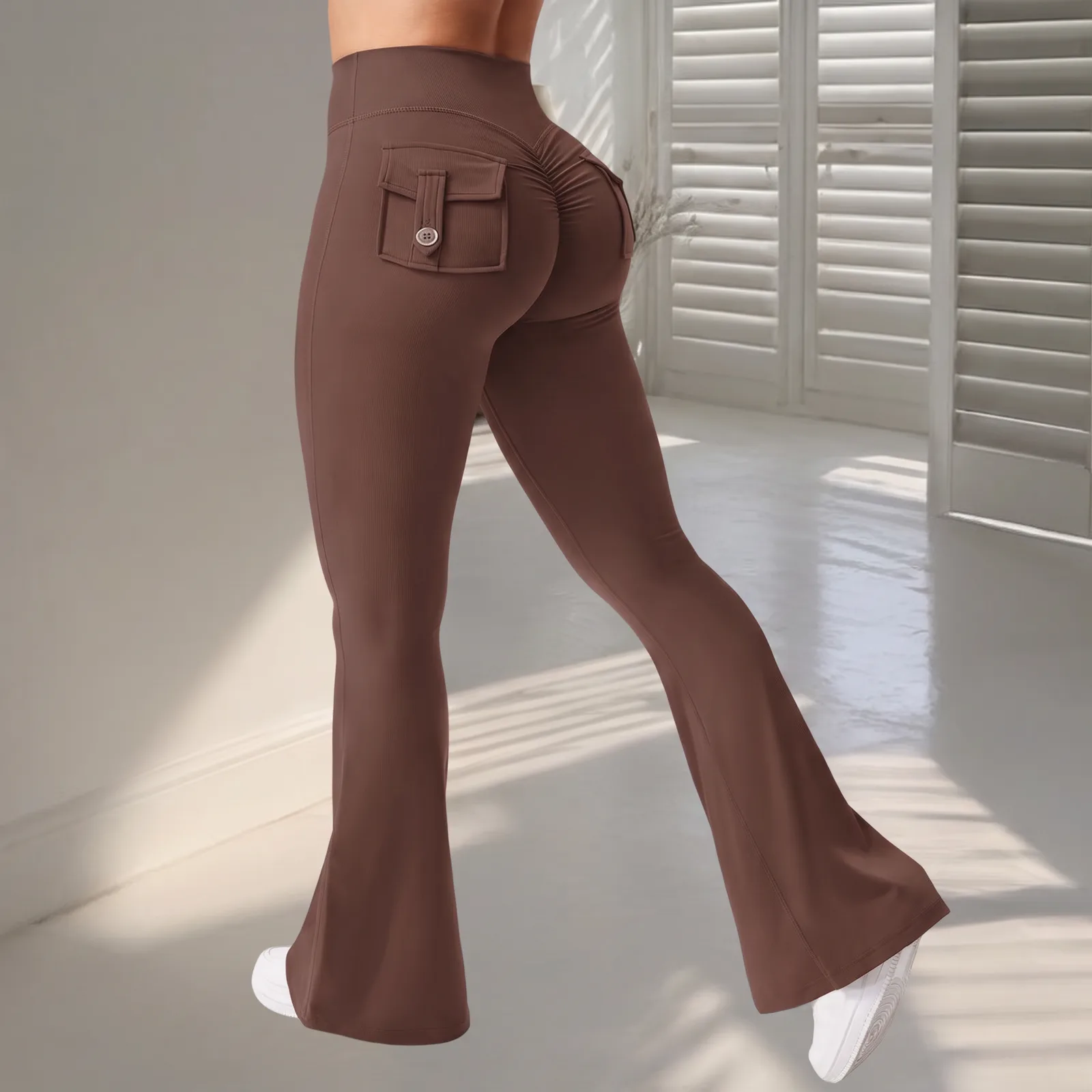 Legs from the waist down wearing the flare leggings, standing in a studio