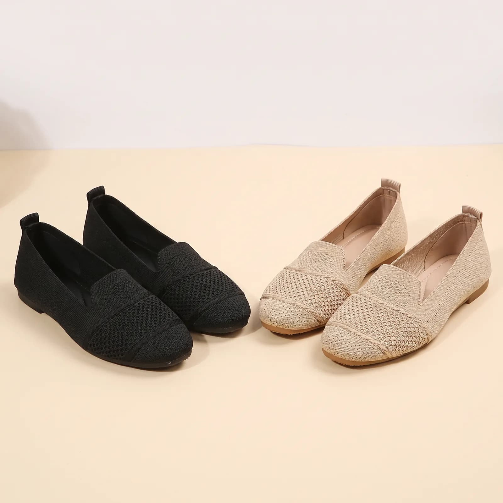 Black and Sand knit flats side by side