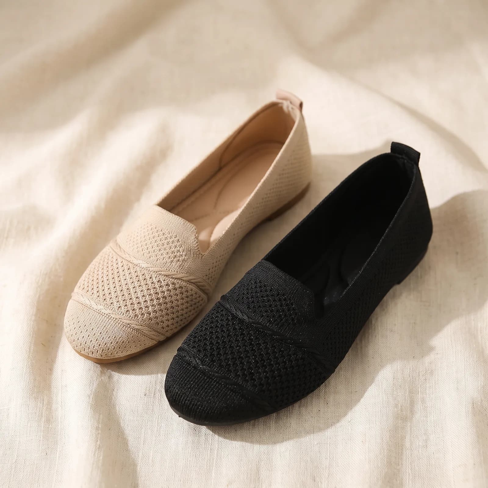 Both flats laid flat top-down on warm cream linen