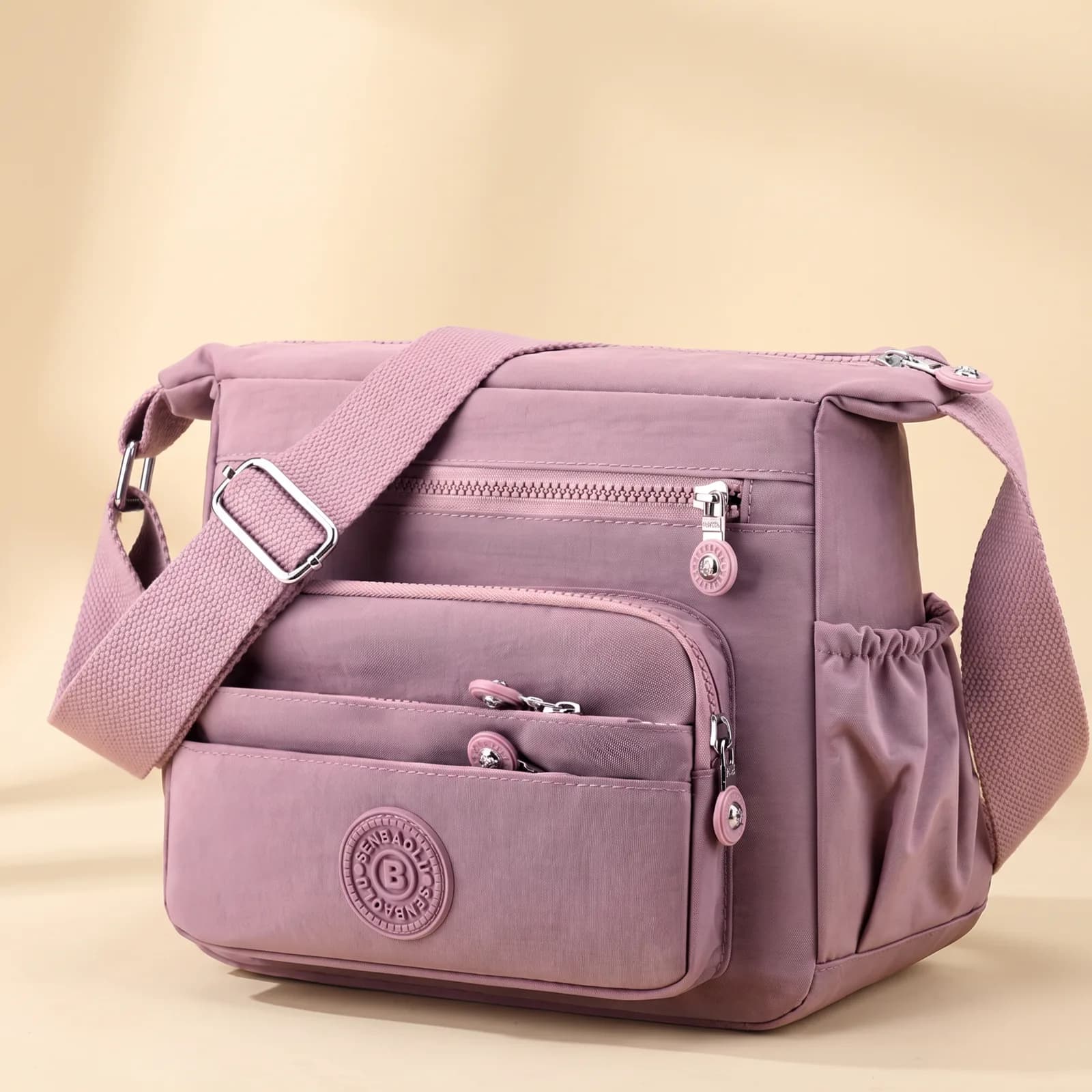 Lightweight Nylon Crossbody in Navy on a cream studio background