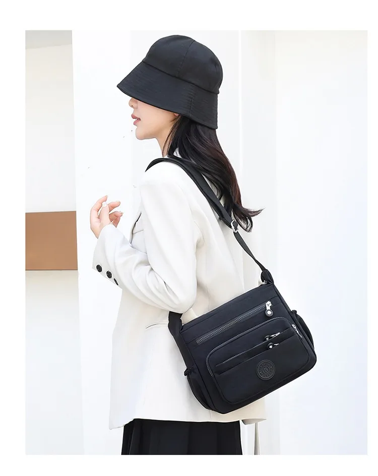 Lightweight Nylon Crossbody in Black, worn by a model