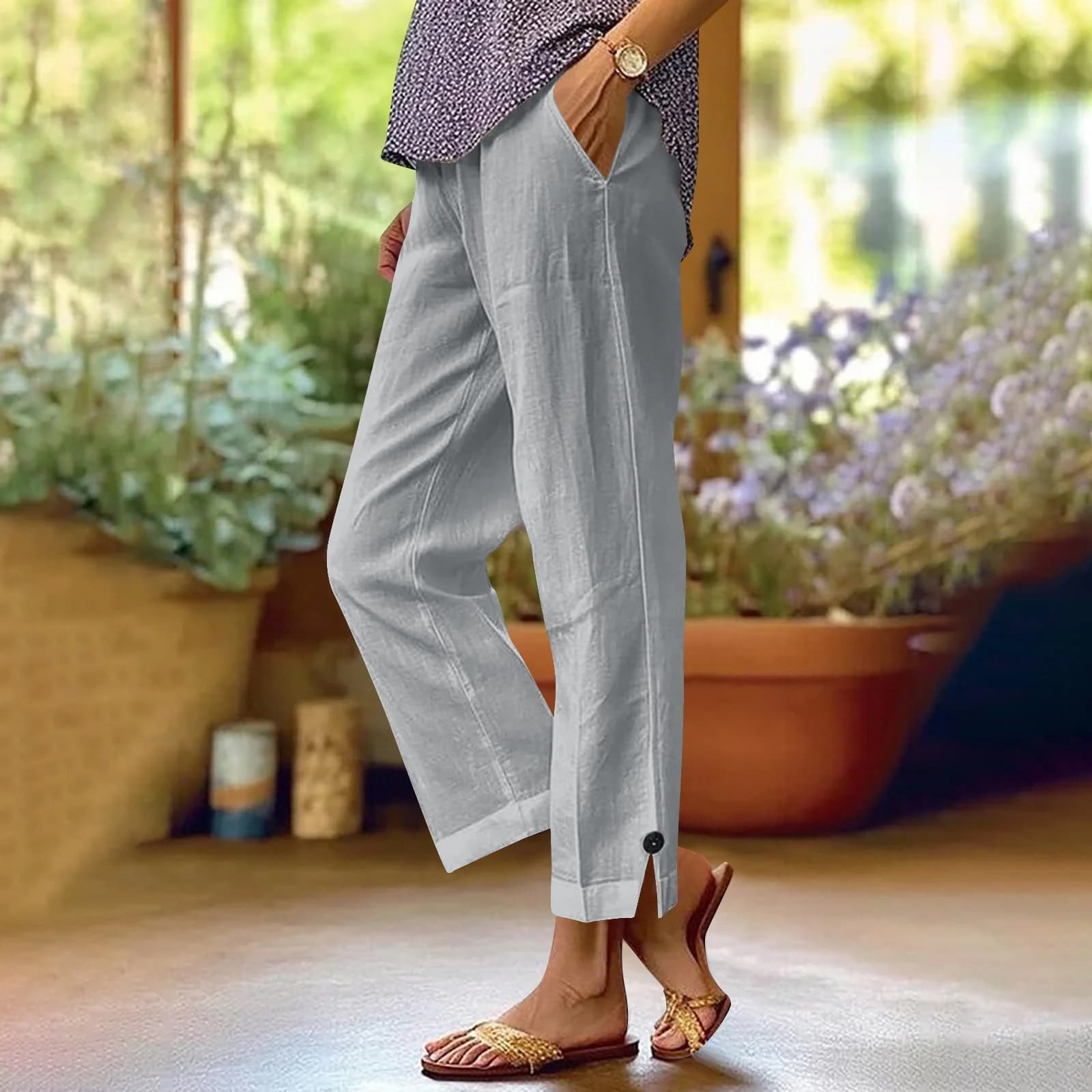 The Light Grey linen-blend pants worn with sandals