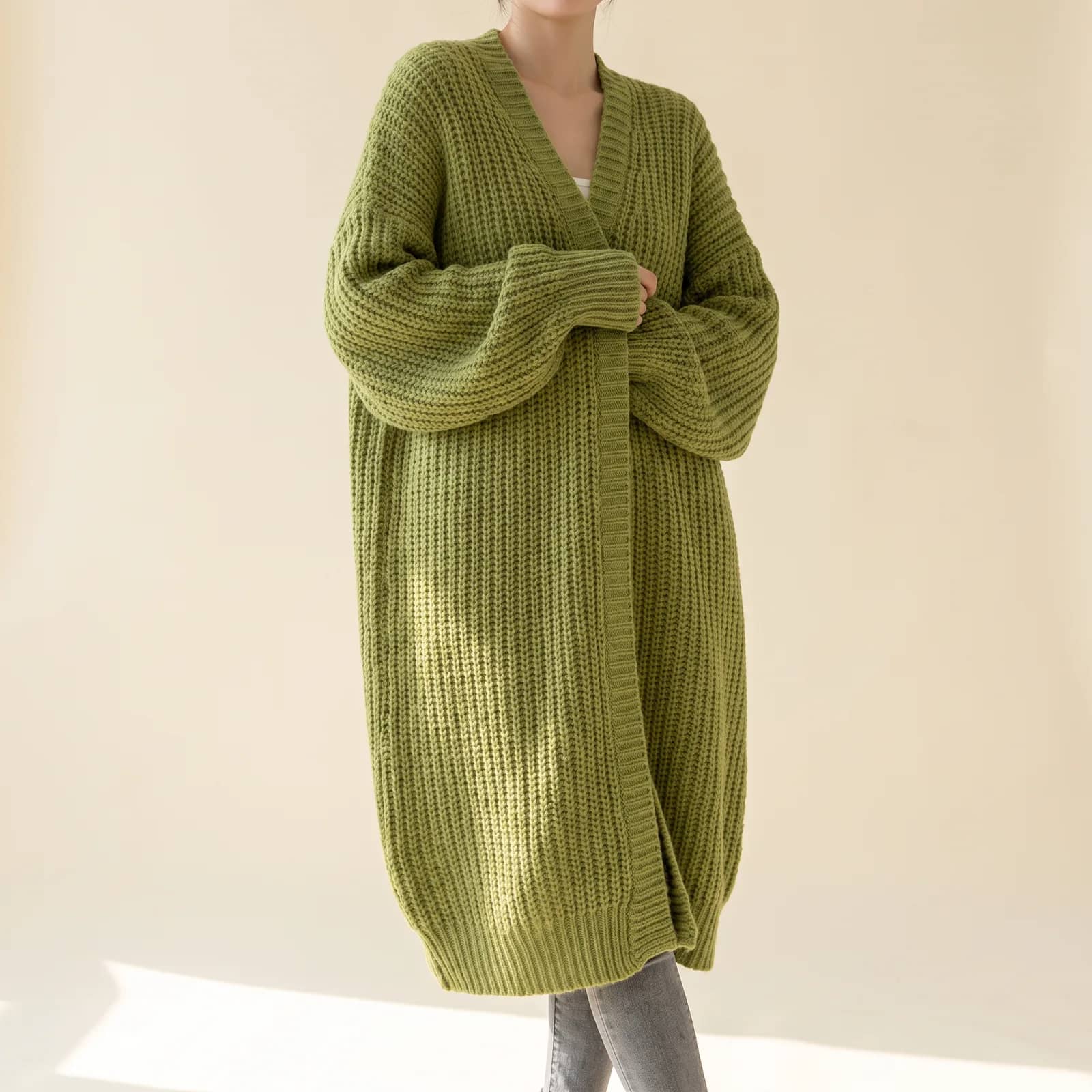 Longline Pocket Knit Cardigan in Grass on a cream studio background