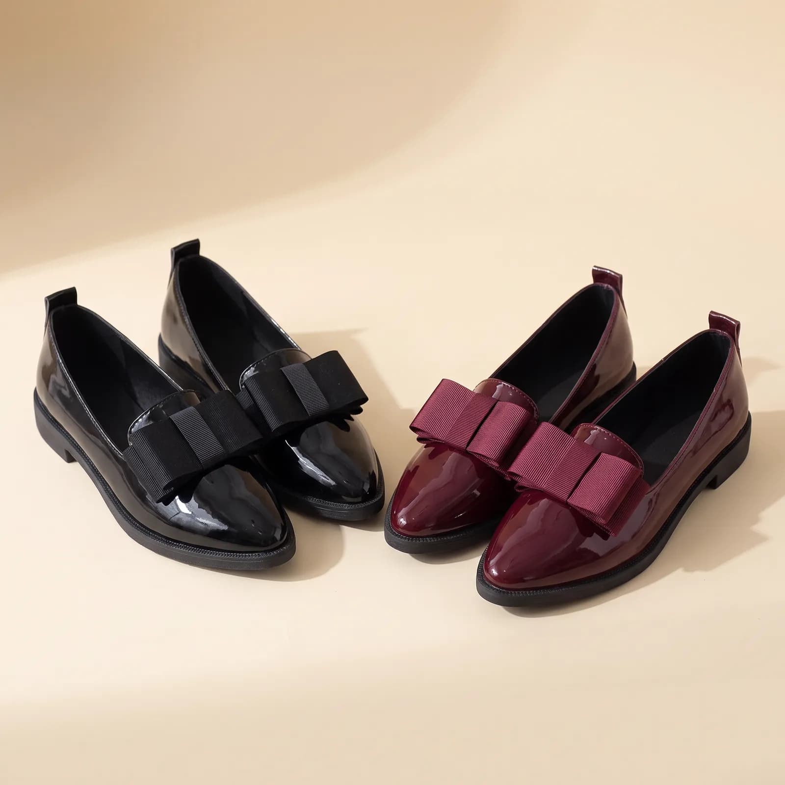 Black and Claret patent flats side by side