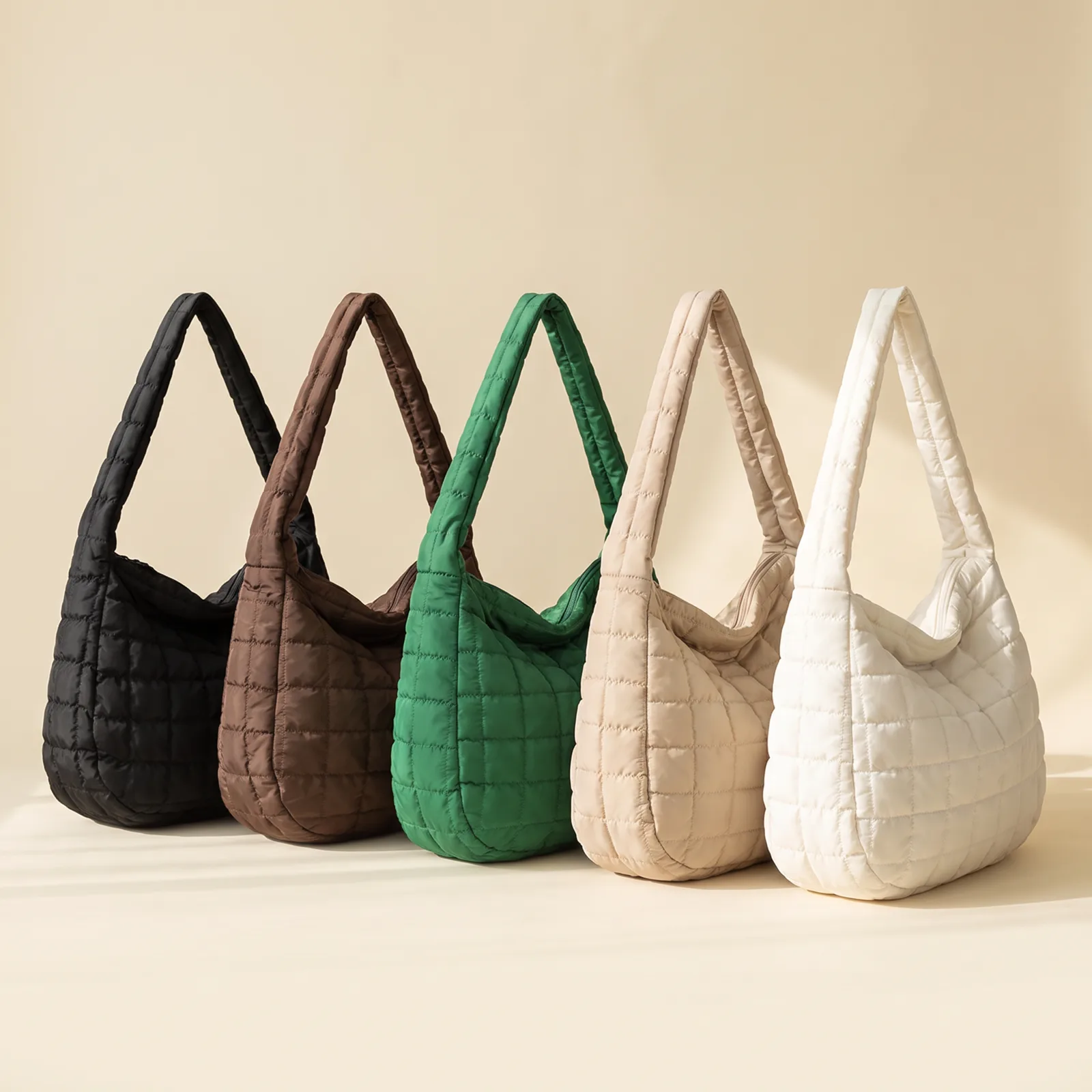 Black, Mocha, Forest, Oat, and Ivory totes lined up side by side