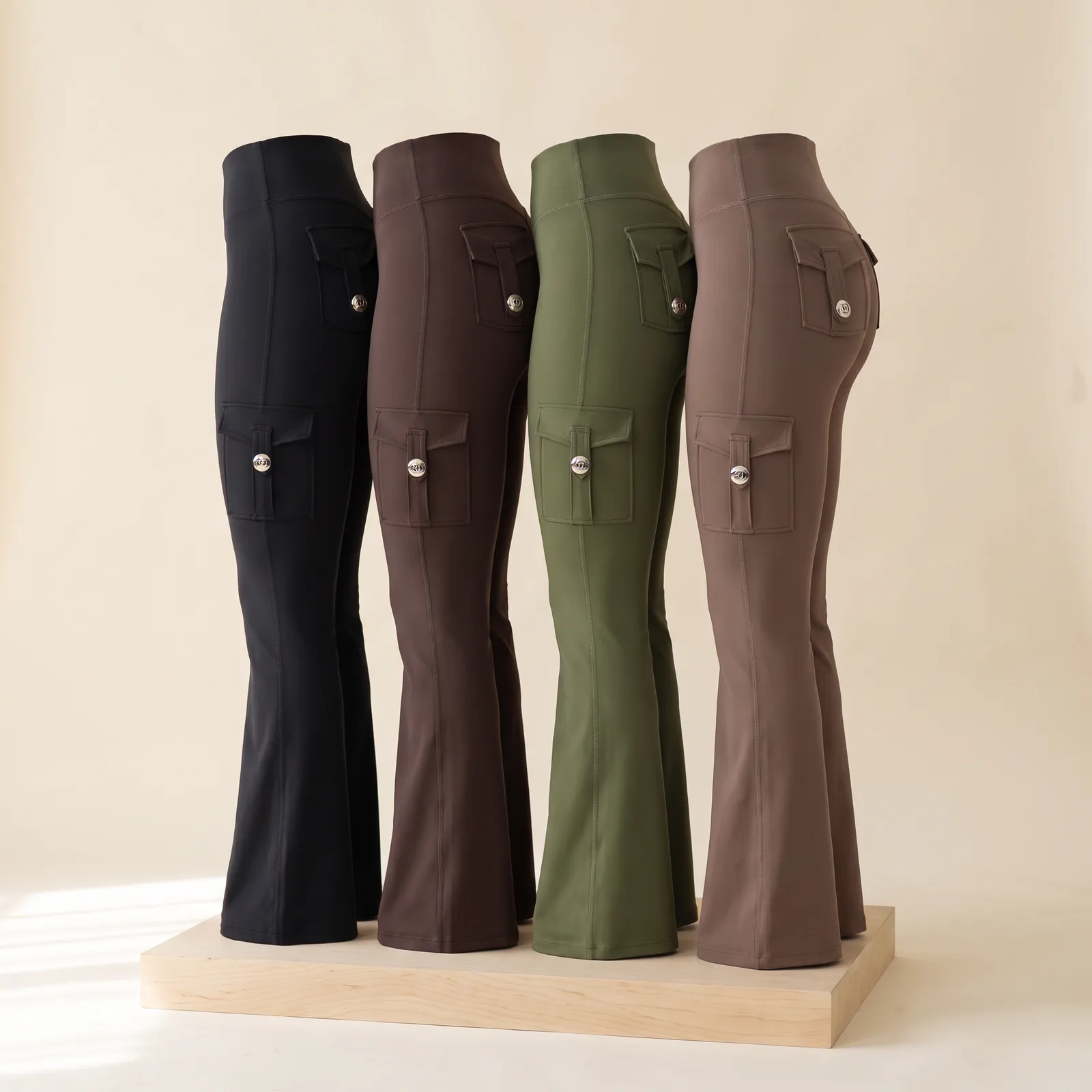 Black, Espresso, Olive, and Cocoa pants lined up side by side