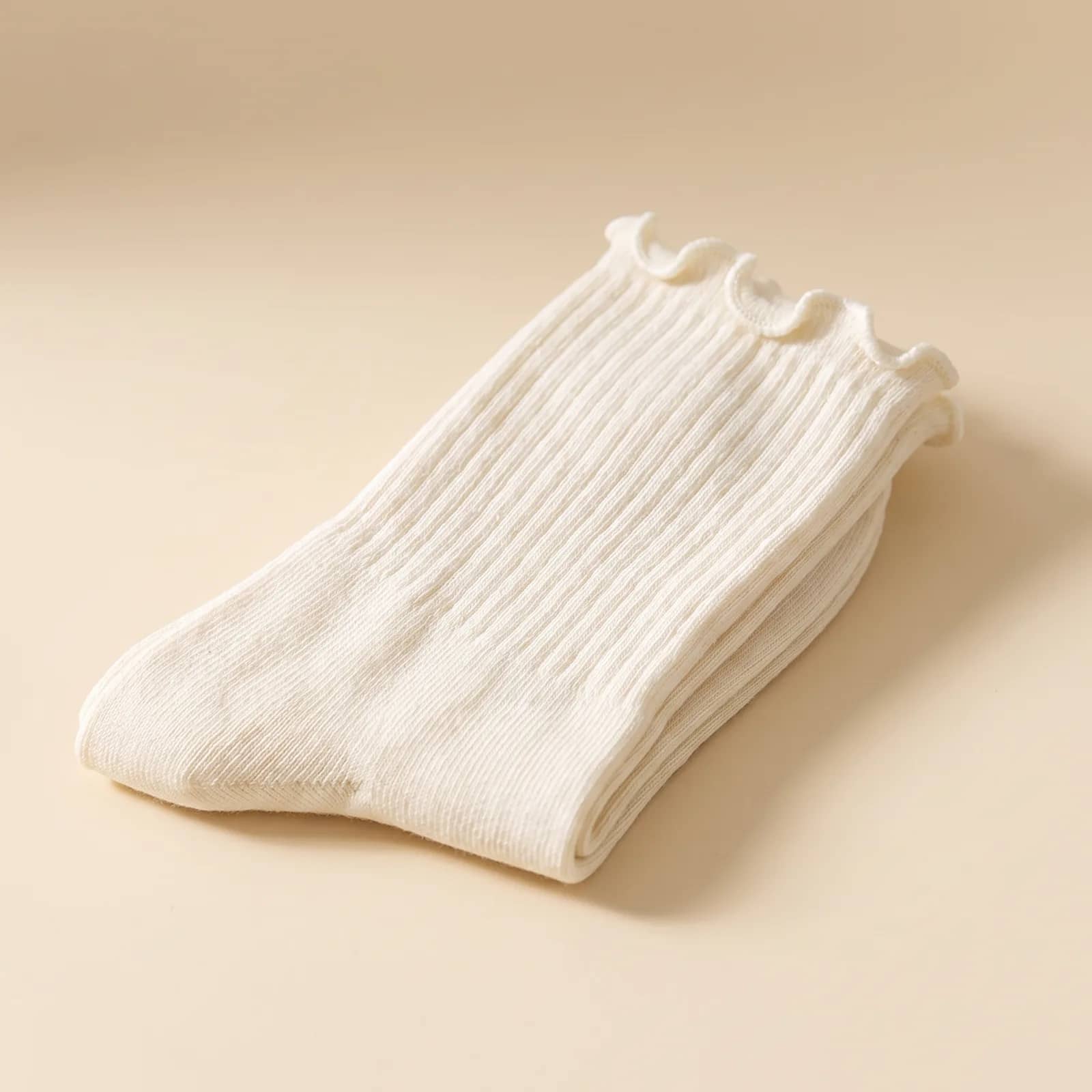 Ruffle Ankle Socks in Oat on a cream studio background