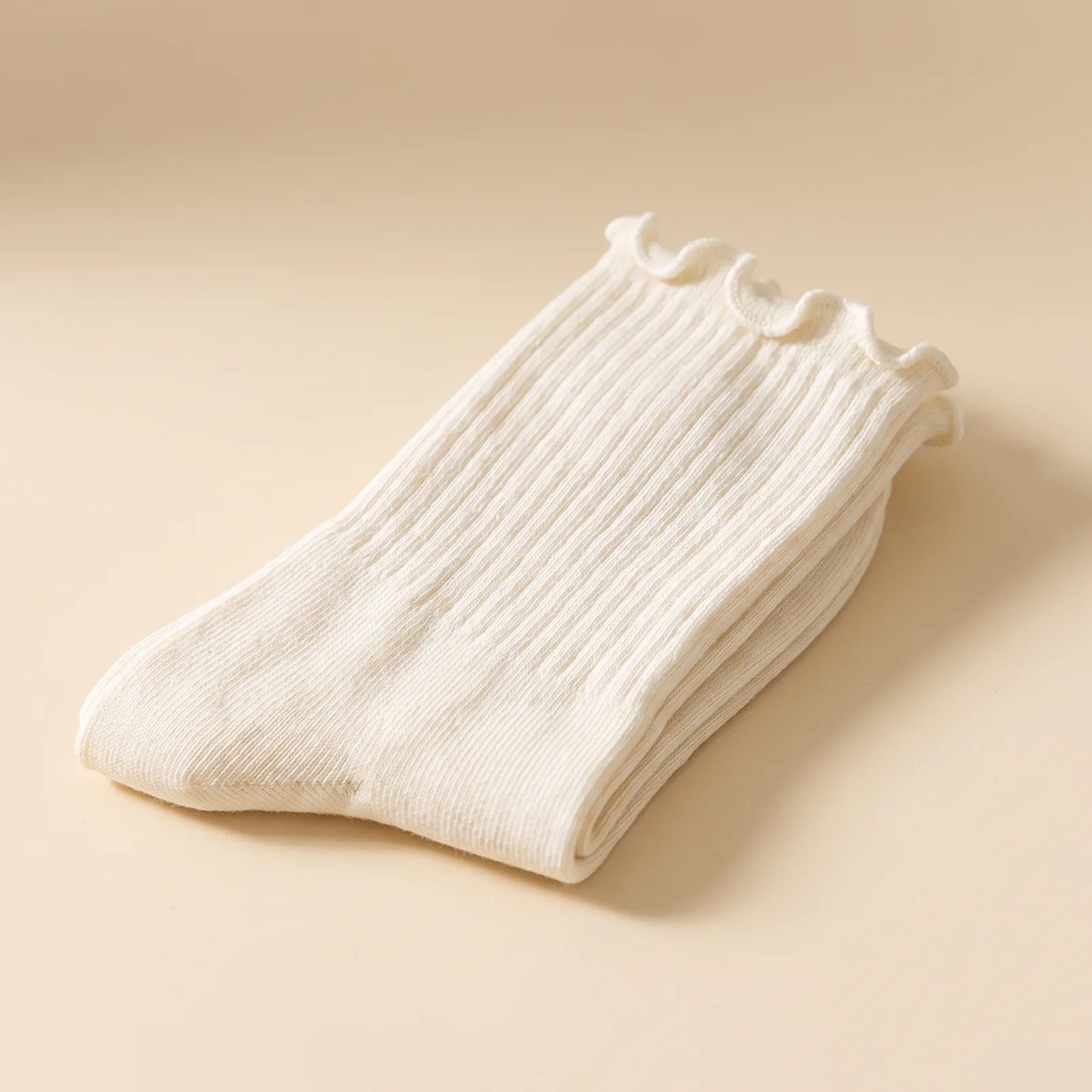 Ruffle Ankle Socks in Oat on a cream studio background