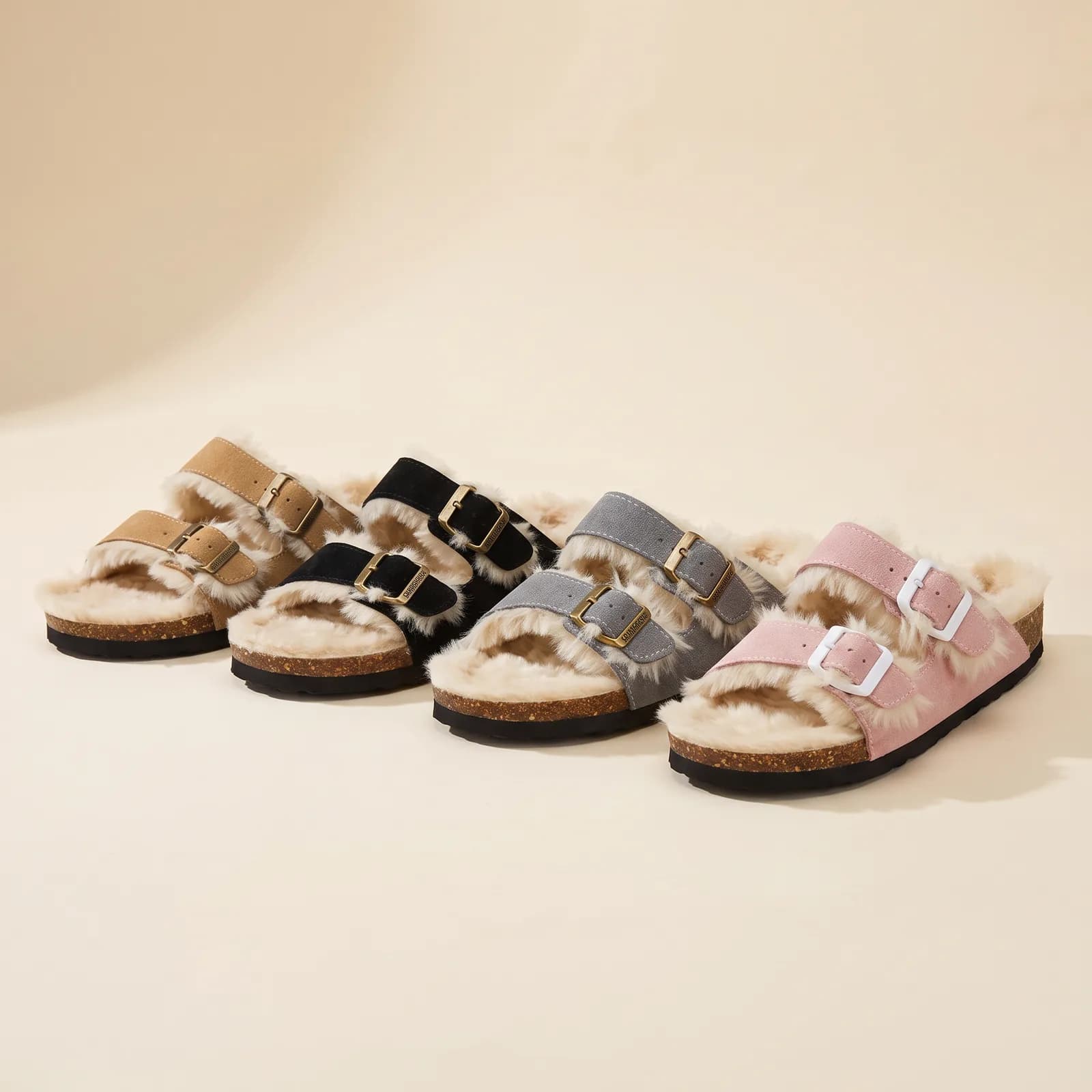 Chestnut Suede, Black Suede, Grey Suede, and Blush Suede clogs lined up side by side