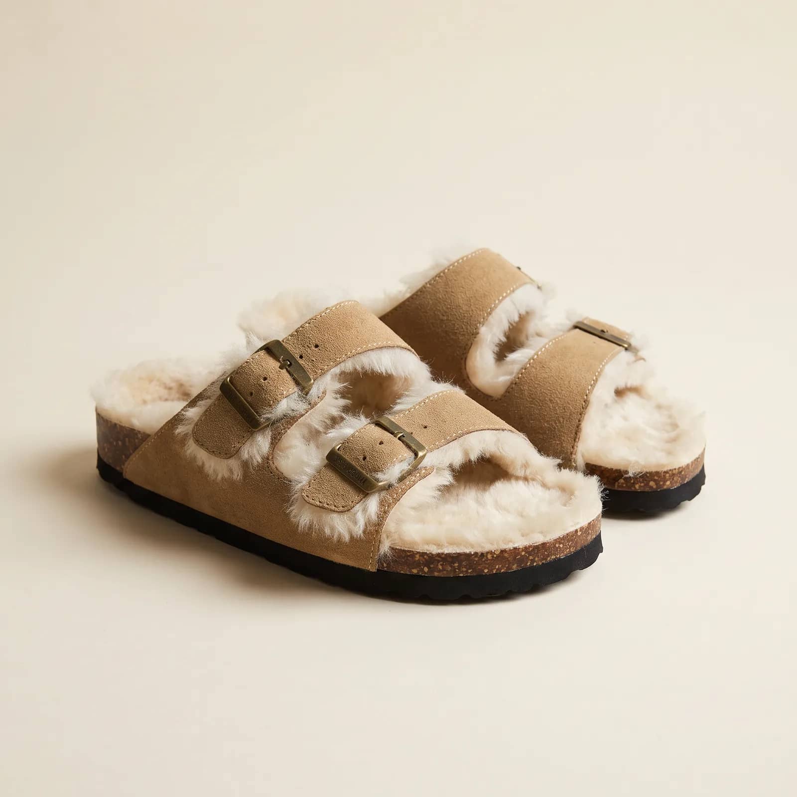 Shearling-Lined Cork Footbed Clogs in Chestnut Suede on a cream studio background