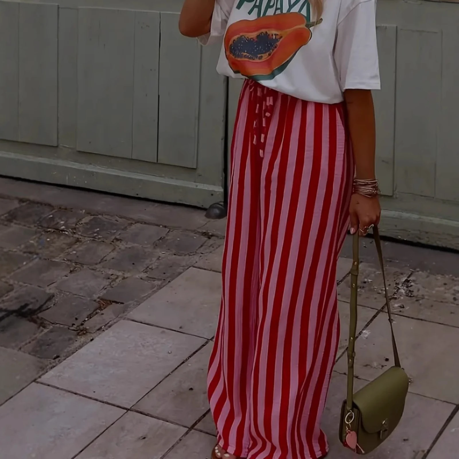 The Red Stripe palazzo pants from the front, showing the drawstring waist