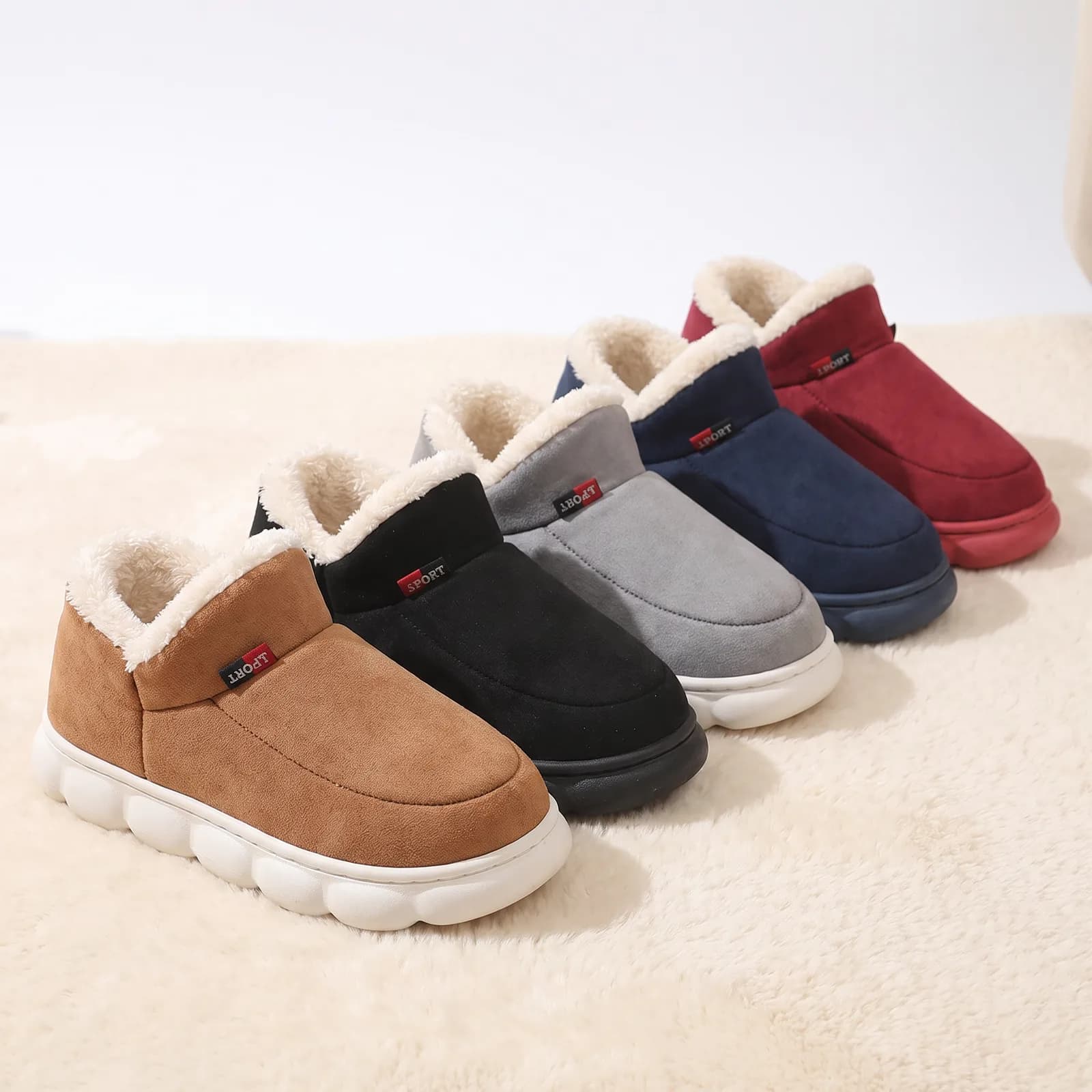 Chestnut, Black, Grey, Navy, and Wine house shoes lined up side by side