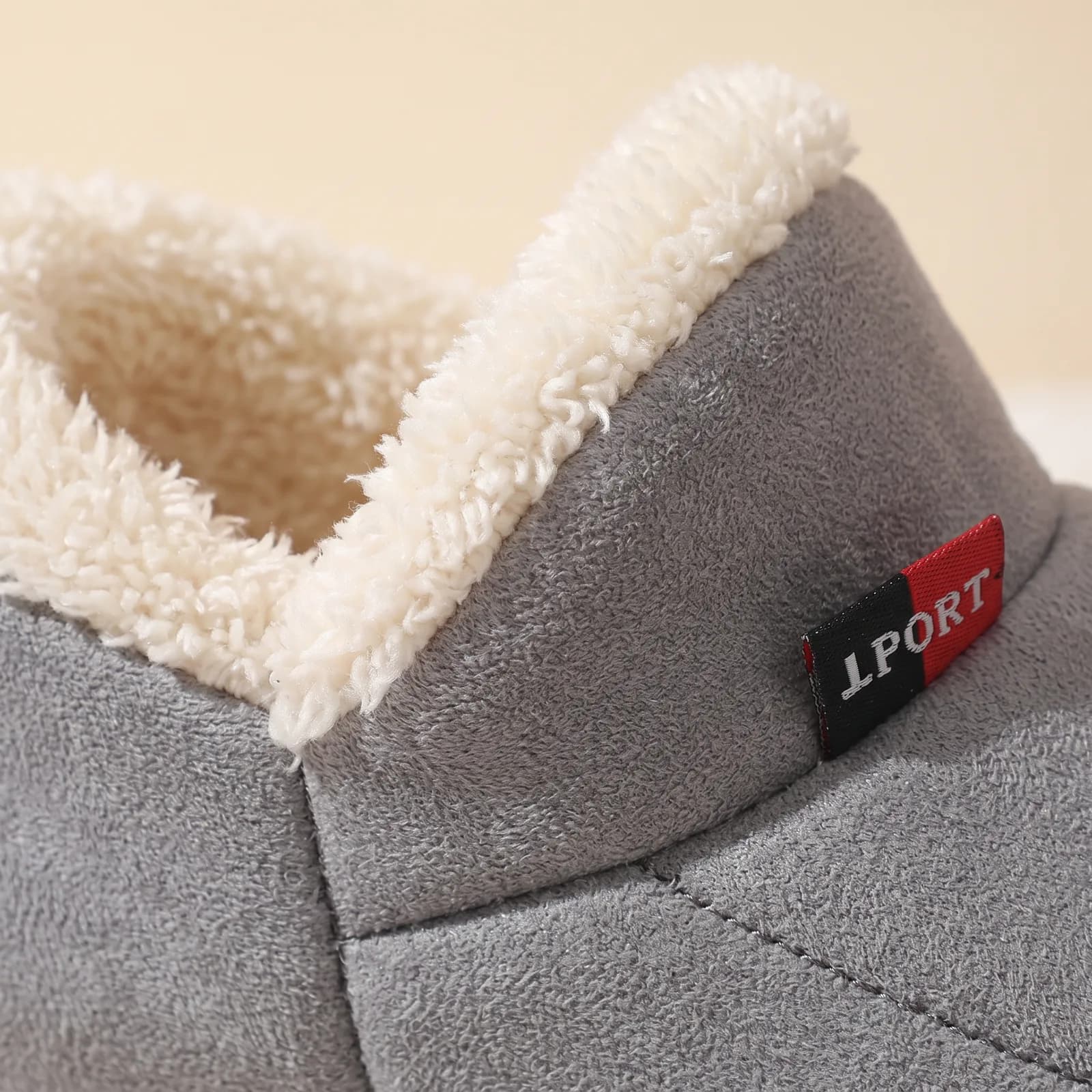 Close-up of the fleece cuff and faux suede upper