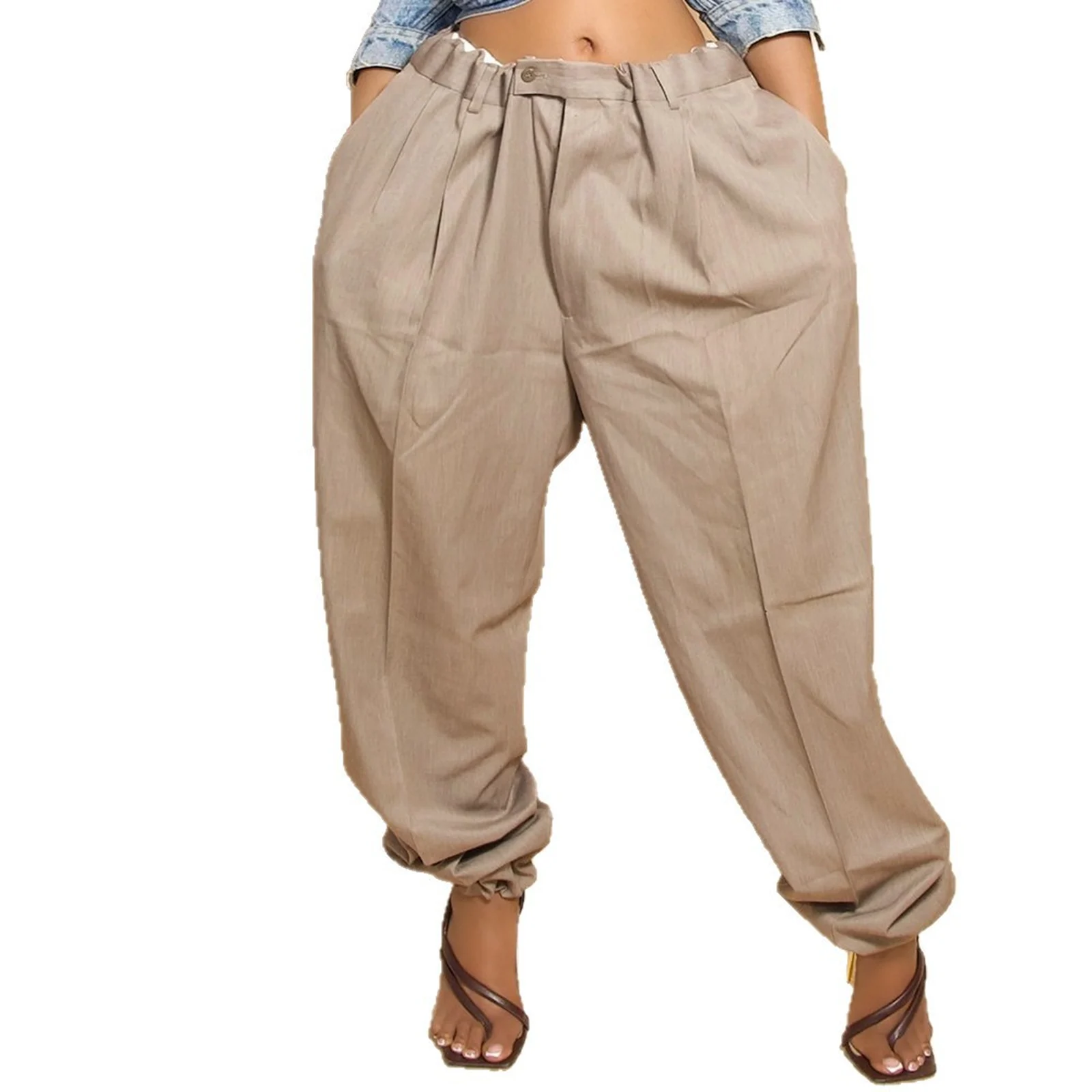 The Khaki barrel travel pants front on, showing the pleats and tapered hem