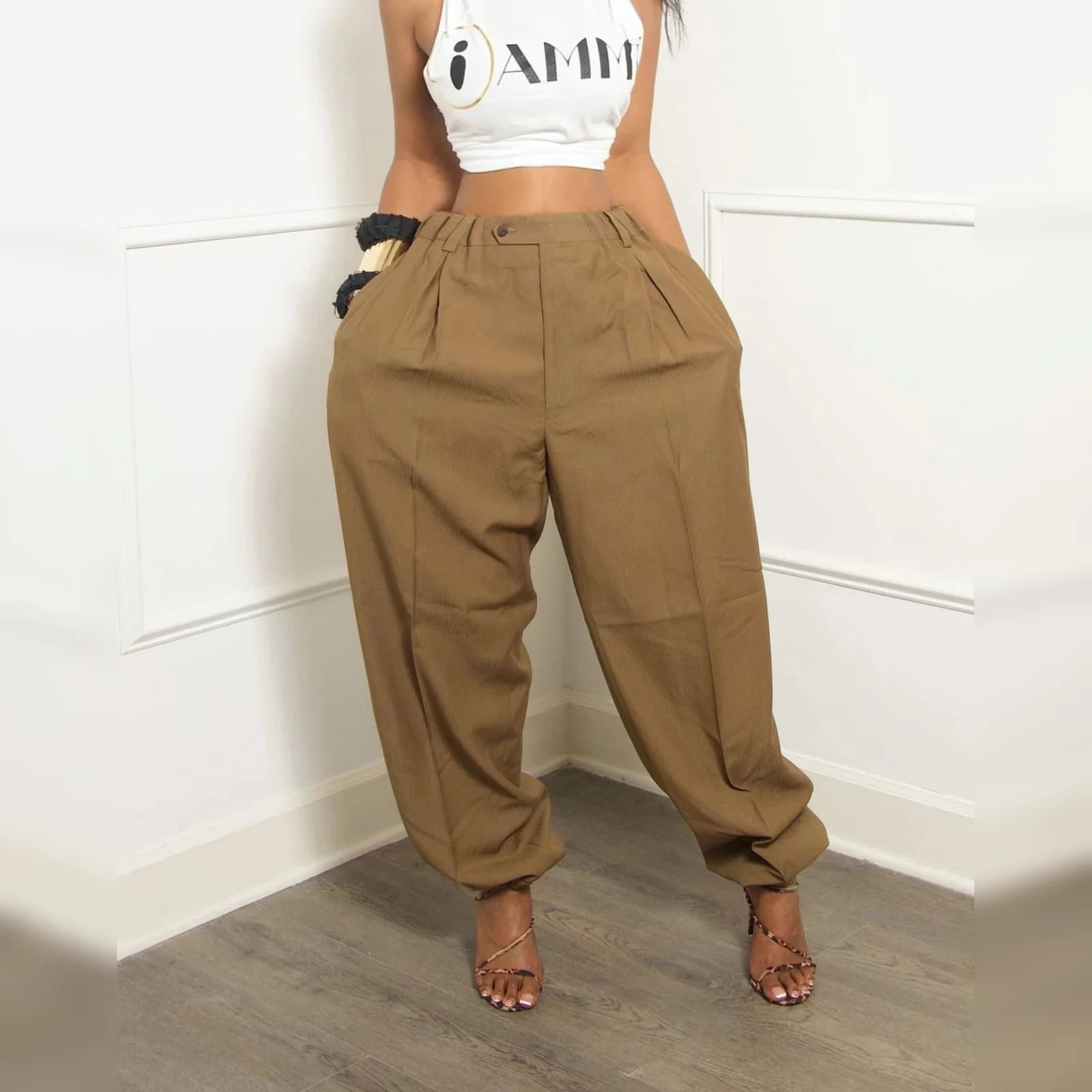 The Camel barrel travel pants worn with a white top