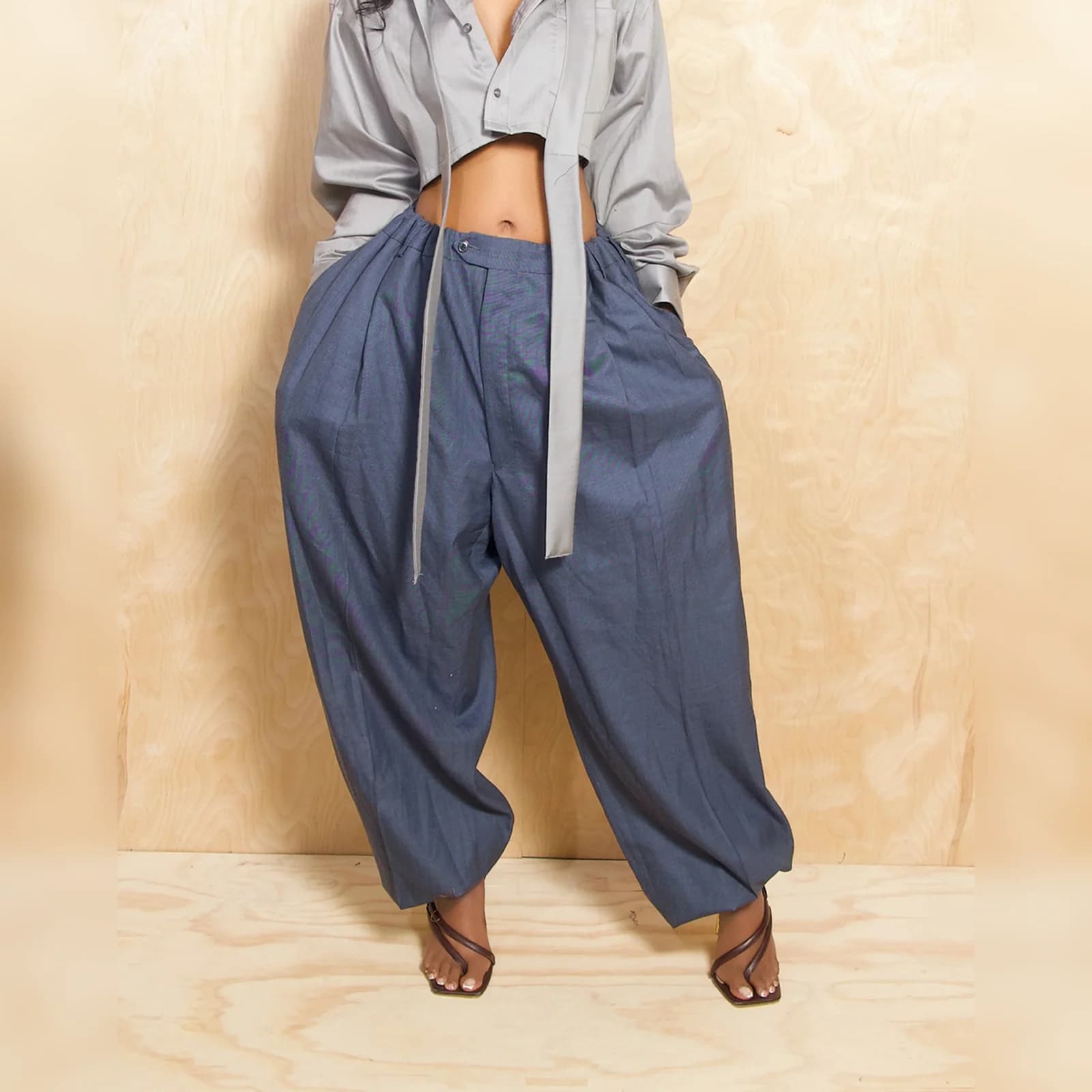 The Blue barrel travel pants worn with a grey shirt