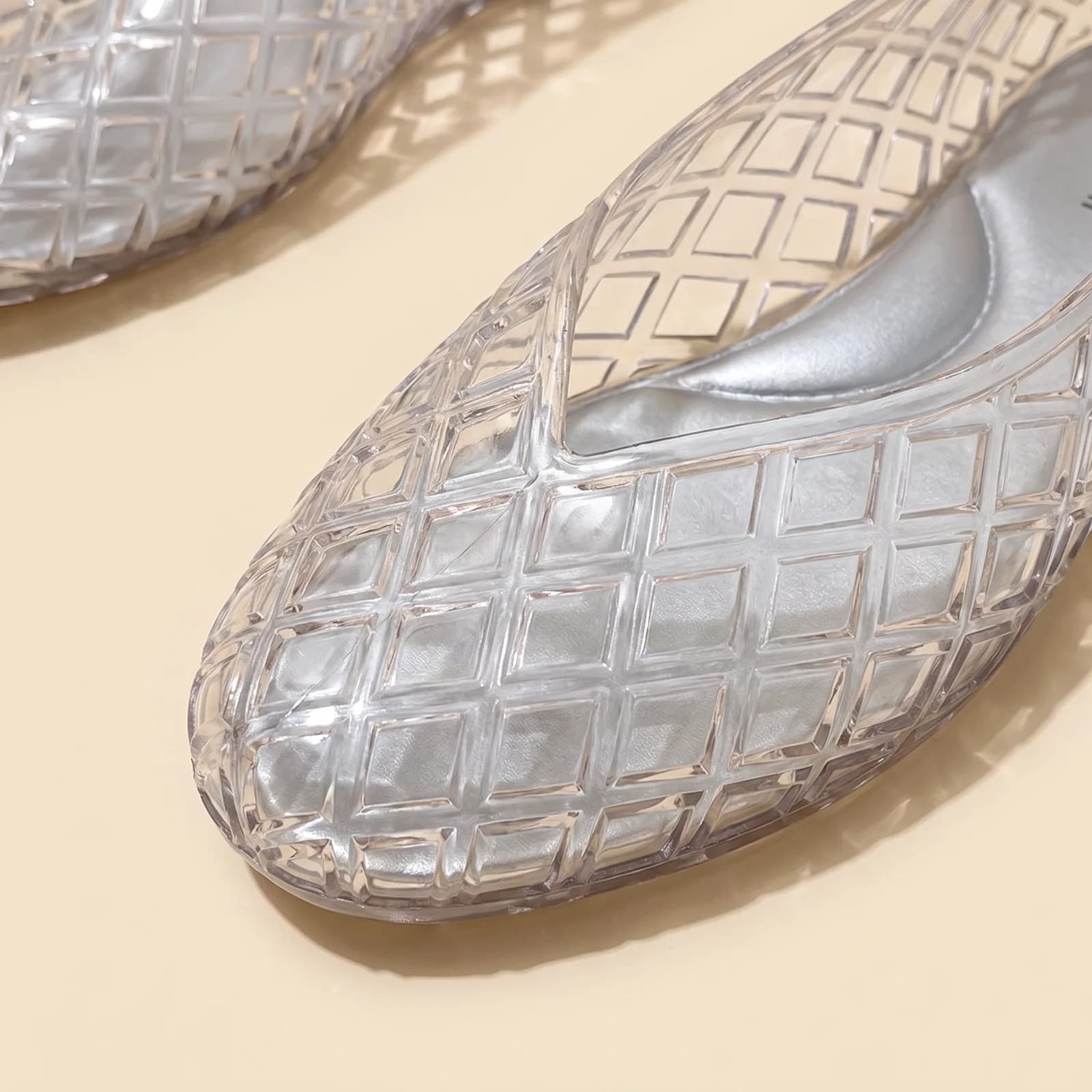 Close-up of the woven lattice pattern and the round toe